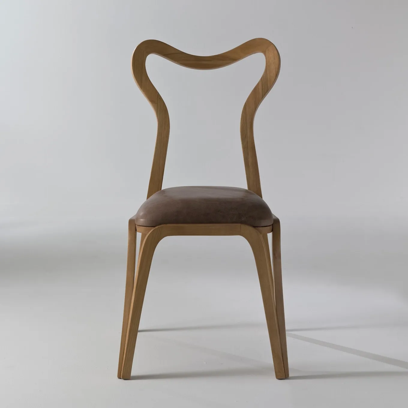 Daina Chair in Walnut with Open Back By Nigel Coates