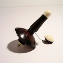 Filo Spinning Top in Ebony, Galalith and Black Palm