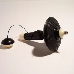 Filo Spinning Top in Ebony, Galalith and Black Palm