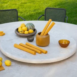 Hermu 230 round beige travertine stone and brown steel outdoor dining table