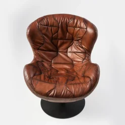 Pelè hand-patinated brown Crust leather swivel armchair