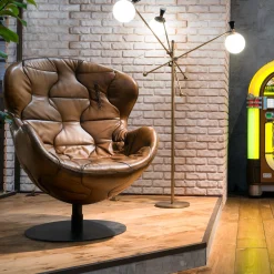 Pelè hand-patinated brown Crust leather swivel armchair