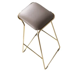 SEEMS SCULPTURAL GOLD AND LEATHER HI STOOL